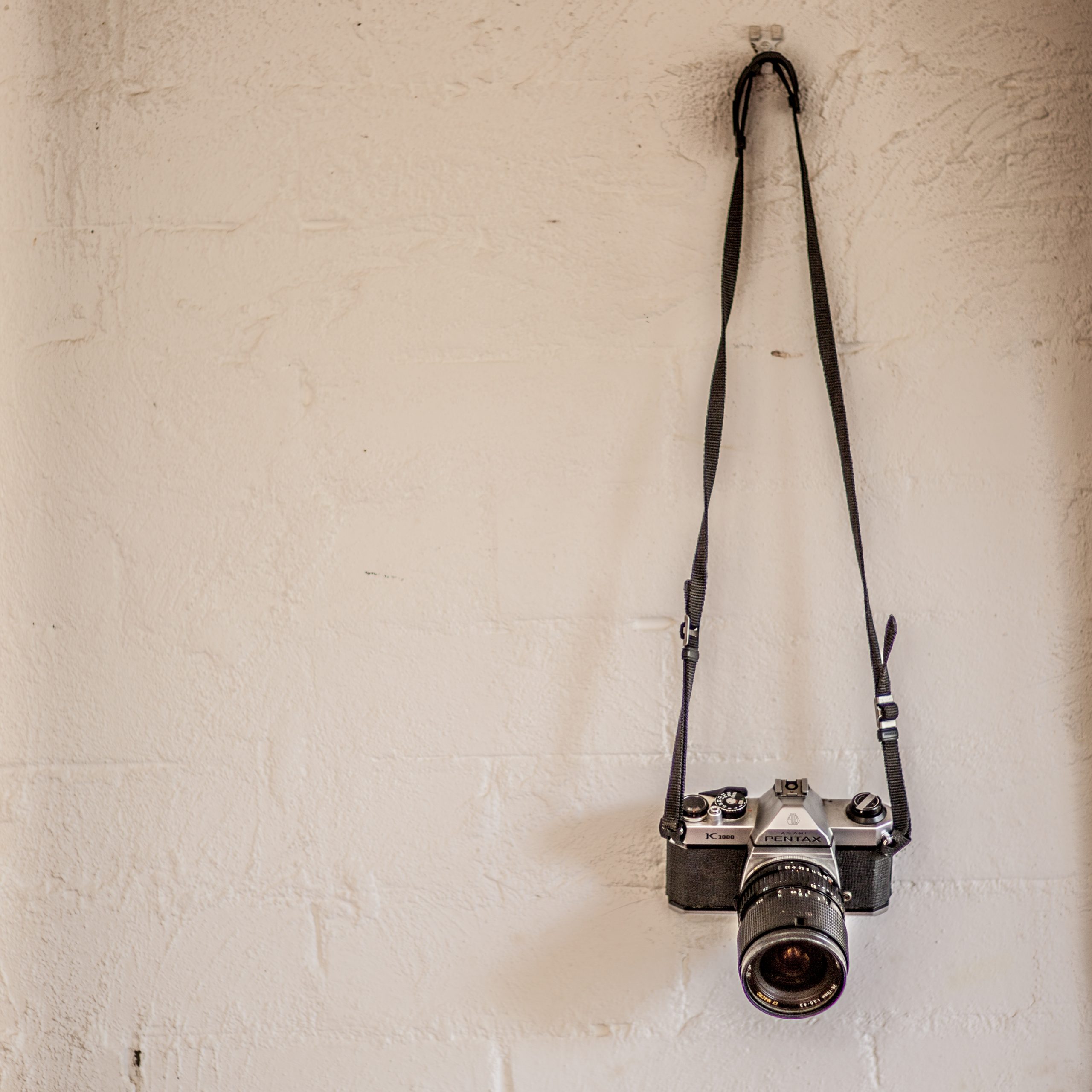 Camera hanging from a wall