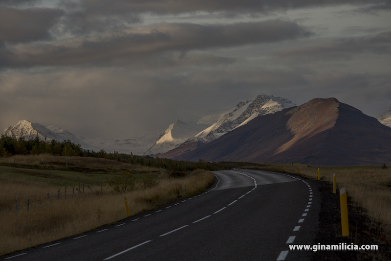 Mountains above a road North Coast, Iceland