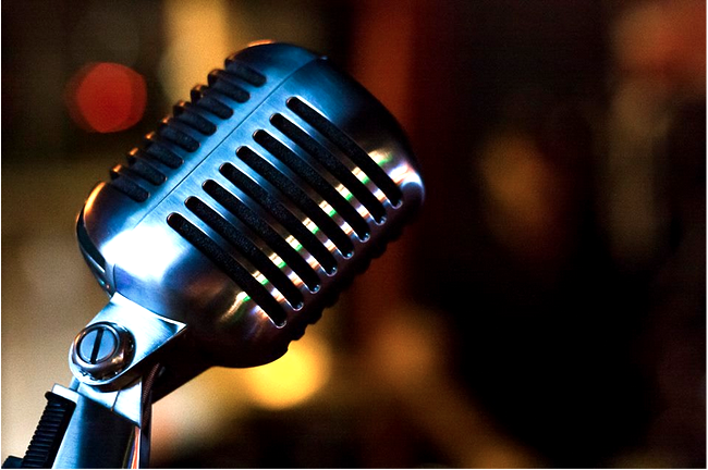 Ron Navarrete photo critique close up of a microphone with a chrome finish and bokeh in the background