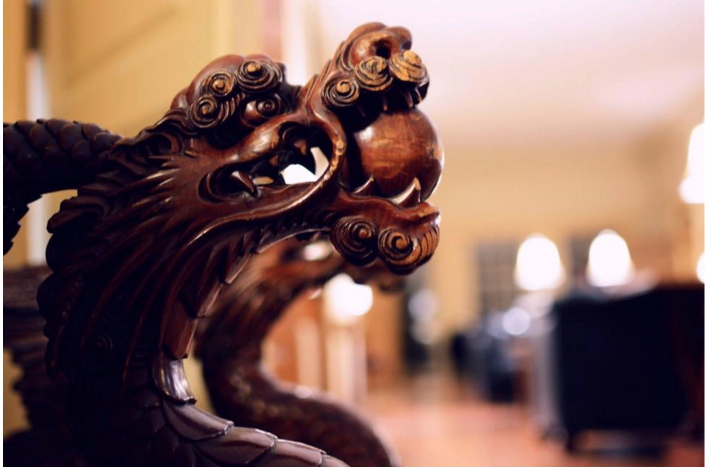 close up photo of a wooden dragon by Tracy Tieman