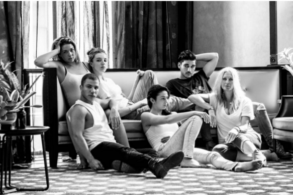 black and white model group shot on a lounge and floor