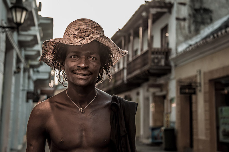 Shirtless Columbian man in the street.
