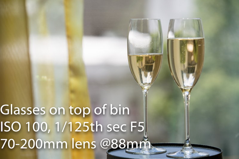 Champagne glasses but focusing on top of bin