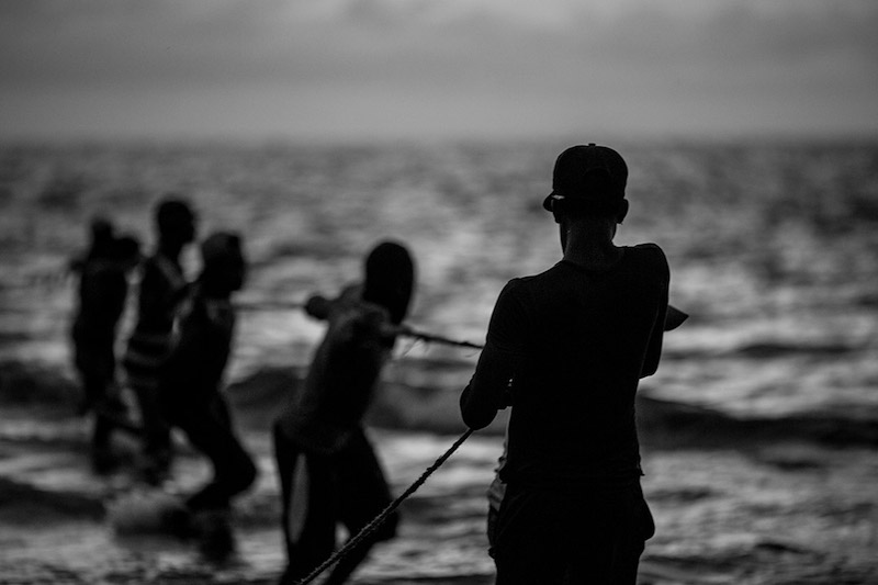 5 Columbian men in the water. Taken by Gina Milcia