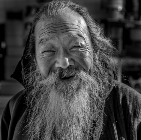 black and white photo of an old man in Shinjuku Japan