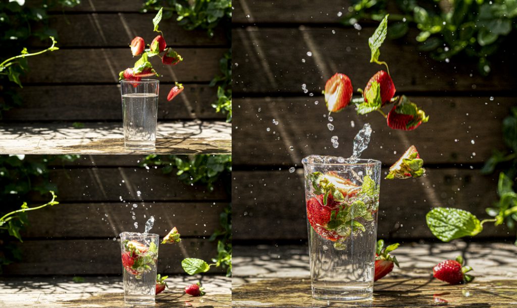 Three images are together in one image. On the left there are two images stacked on top of each other and one image on the right. The two images on the left show strawberries being dropped into a glass of water in a garden. The image on the right shows how the two images on the left have been used to create one composite image.